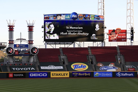The videoboard pays tribute to late Supreme Court Justice Ruth Bader Ginsburg prior to a baseball game between the Chicago White Sox and the Cincinnati Reds in Cincinnati, Saturday, Sept. 19, 2020. (A ...