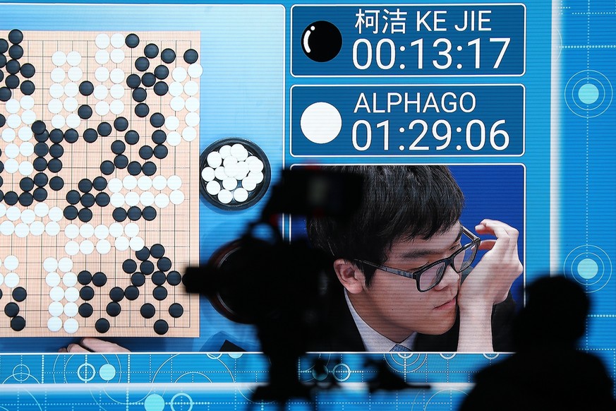 epa05982814 A screen shows Chinese Go player Ke Jie after he lost a match to Google&#039;s artificial intelligence program AlphaGo during the Future of Go Summit at Wuzhen internet International Confe ...