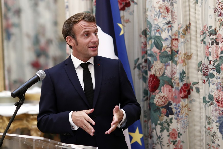 epa08657392 French President Emmanuel Macron delivers a speech before a dinner with local officials marking the anniversary of the liberation of Ajaccio of 09 September 1943, in Ajaccio on the island  ...