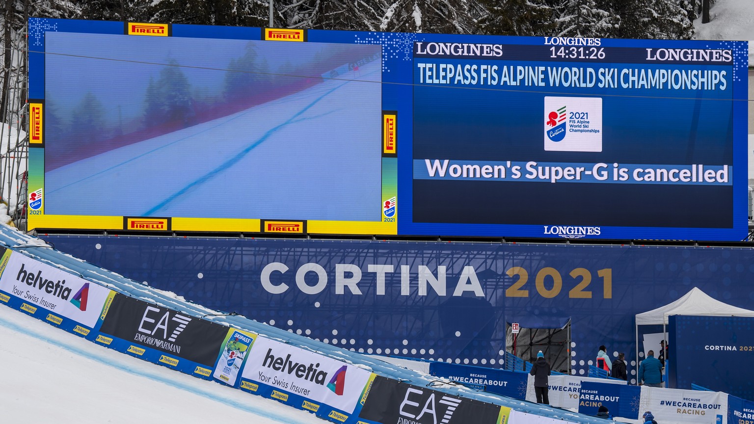 epa08998687 A TV screen is pictured in the finish area after the cancellation due to the fog of the Women&#039;s Super-G race at the 2021 FIS Alpine Skiing World Championships in Cortina d&#039;Ampezz ...
