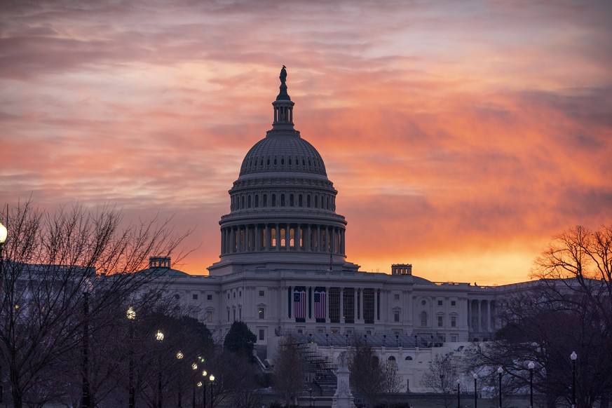 Dawn breaks at the Capitol in Washington, Monday, Jan. 11, 2021. House Speaker Nancy Pelosi, D-Calif., is calling for congressional action to rein in President Donald Trump after inciting last week&#0 ...