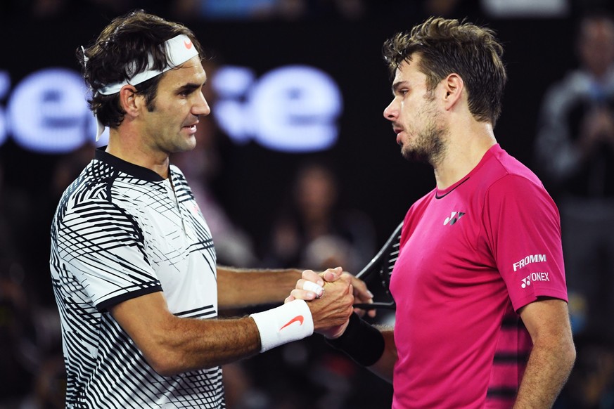 epa05751875 Roger Federer (L) of Switzerland shakes hands with Stan Wawrinka (R) of Switzerland whom he defeated in the Men&#039;s Singles semifinal match at the Australian Open Grand Slam tennis tour ...