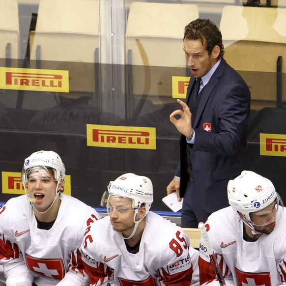 Patrick Fischer, head coach of Switzerland national ice hockey team, gestures behind his players, during the IIHF 2018 World Championship quarter final game between Finland and Switzerland, at the Jys ...