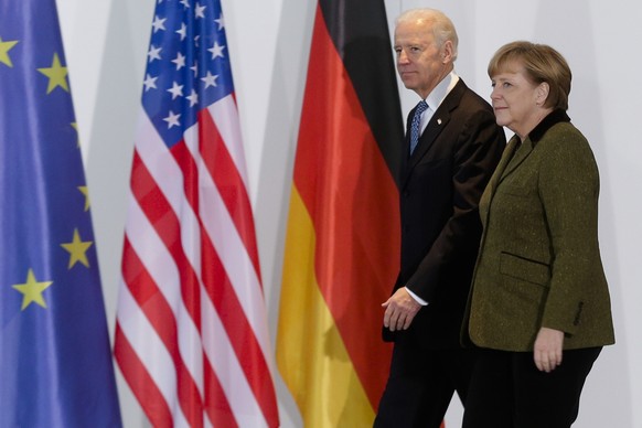 File---File picture taken Friday, Feb. 1, 2013 shows German Chancellor Angela Merkel, right, and United States&#039; Vice President Joe Biden at the chancellery in Berlin, Germany. (AP Photo/Markus Sc ...