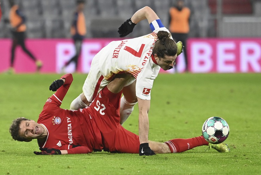 Leipzig&#039;s Marcel Sabitzer (7) and Bayern&#039;s Thomas Muller compete for the ball during a German Bundesliga soccer match between Bayern Munich and RB Leipzig in Munich, Germany, Saturday, Dec.  ...