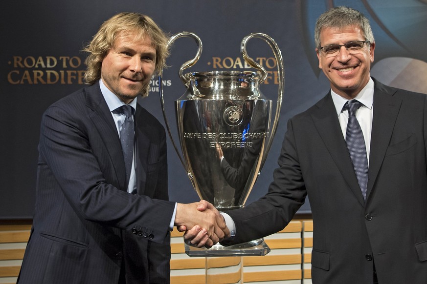 epa05854044 Juventus vice-president Pavel Nedved (L) and FC Barcelona&#039;s vice-president Jordi Mestre (R) shake hands next to the Champions League trophy following the quarter-final draw of the UEF ...
