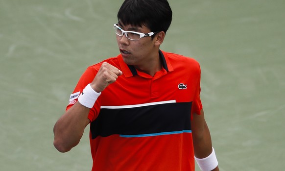 Hyeon Chung, of South Korea, reacts during a first round match against Feliciano Lopez, of Spain, at the Western &amp; Southern Open tennis tournament, Monday, Aug. 14, 2017, in Mason, Ohio. (AP Photo ...