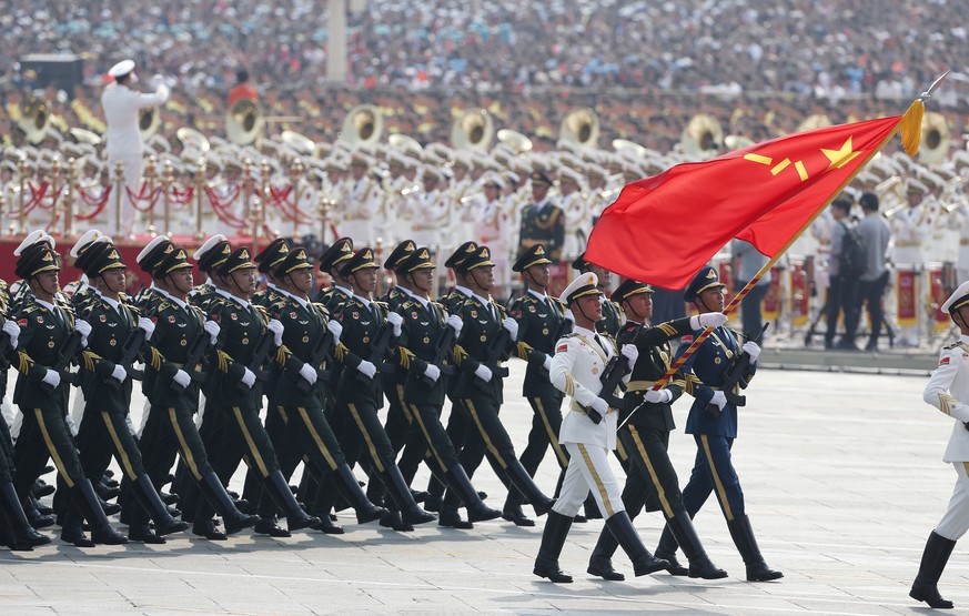 epa07884029 Chinese troops march past Tiananmen Square during a military parade marking the 70th anniversary of the founding of the People&#039;s Republic of China, in Beijing, China, 01 October 2019. ...