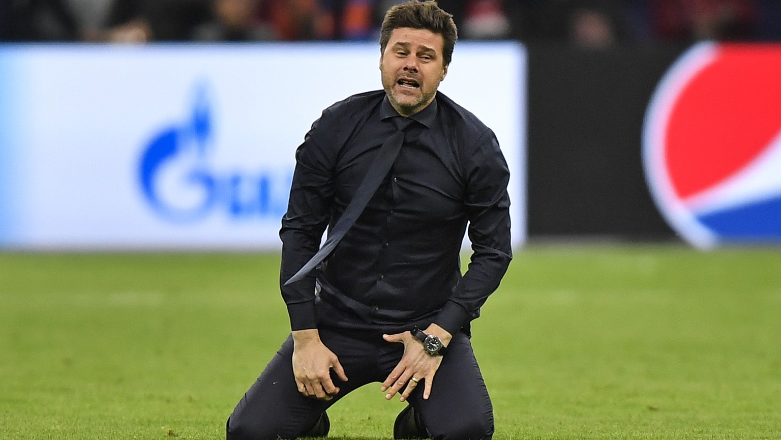 Tottenham manager Mauricio Pochettino celebrates on the pitch after his team scored their third goal during the Champions League semifinal second leg soccer match between Ajax and Tottenham Hotspur at ...