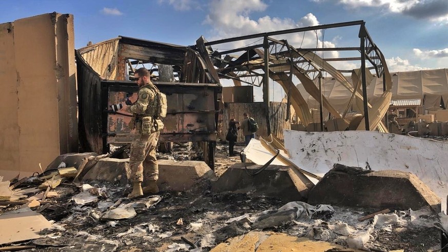 U.S. soldiers and journalists inspect the rubble at a site of Iranian bombing, in Ain al-Asad air base, Anbar, Iraq, Monday, Jan. 13, 2020. Ain al-Asad air base was struck by a barrage of Iranian miss ...