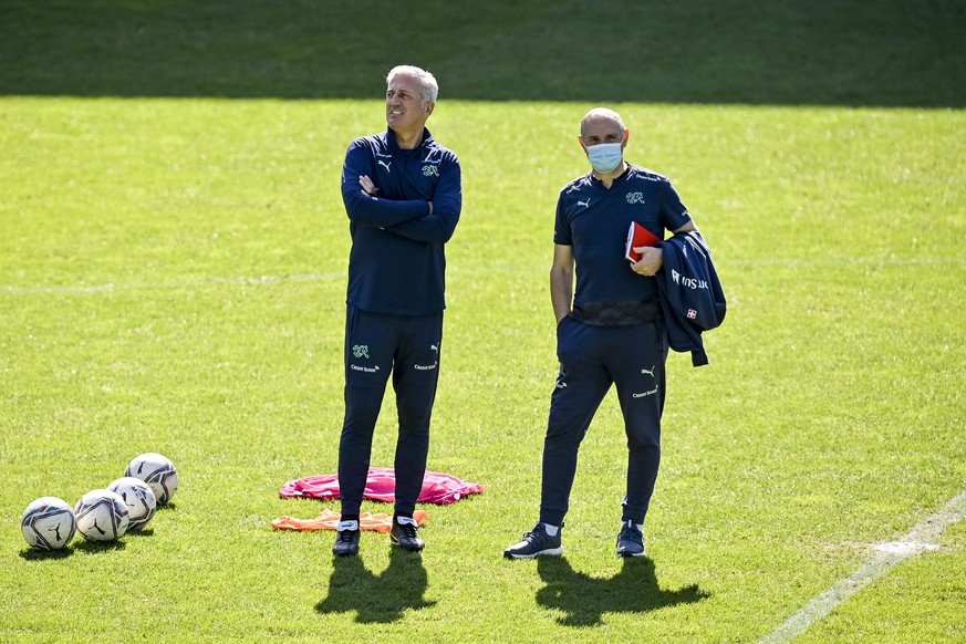 epa09106360 Switzerland&#039;s head coach Vladimir Petkovic (L) and Switzerland&#039;s Director of Professional Football, Pierluigi Tami, during a training session at the Kybunpark stadium in St. Gall ...