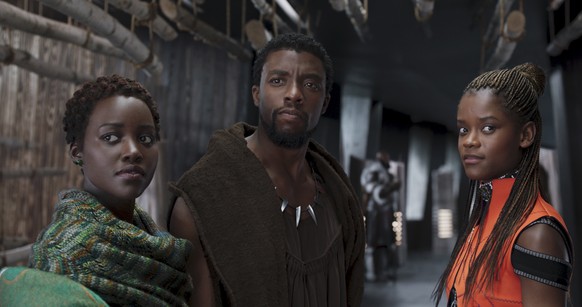 This image released by Disney shows Lupita Nyong&#039;o, from left, Chadwick Boseman and Letitia Wright in a scene from &quot;Black Panther.&quot; The cast was nominated for a SAG Award for best ensem ...