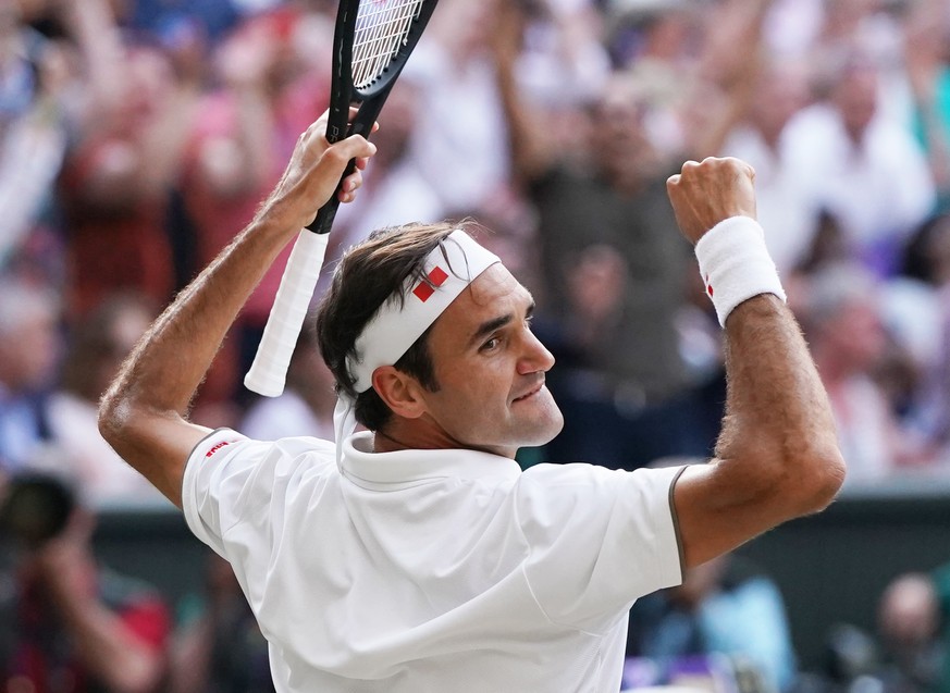 epa07713079 Roger Federer of Switzerland celebrates his win over Rafael Nadal of Spain in their semi final match during the Wimbledon Championships at the All England Lawn Tennis Club, in London, Brit ...