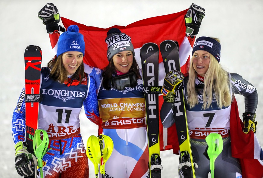 epa07353205 (L-R) second placed Petra Vlhova of Slovakia, winner Wendy Holdener of Switzerland and third placed Ragnhild Mowinckel of Norway celebrate on the podium for the Women&#039;s Alpine Combine ...