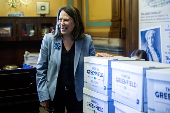 FILE - In this March 4, 2020 file photo, Theresa Greenfield, Democratic candidate for U.S. Senate, smiles at the Iowa State Capitol in Des Moines. Iowa. Greenfield will participate in a debate against ...