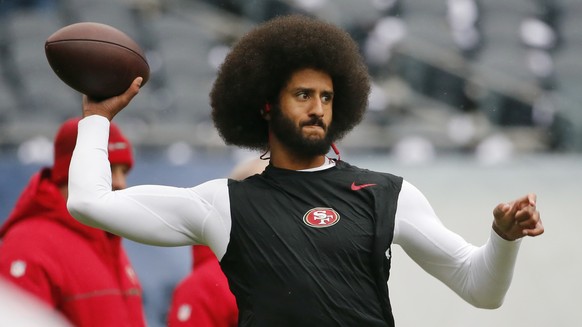 FILE - In this Dec. 4, 2016, file photo, San Francisco 49ers quarterback Colin Kaepernick warms up before an NFL football game against the Chicago Bears. Spike Lee said on Instagram Sunday, March 19,  ...