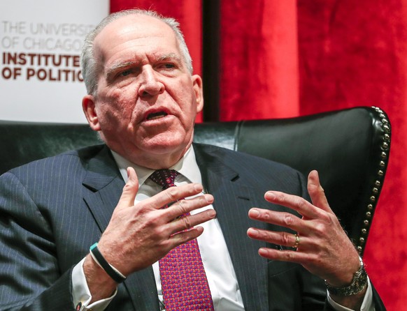 epa05700409 CIA Director John Brennan gestures as he speaks at a forum at the University of Chicago Institute of Politics in the International House on the campus in Chicago, Illinois, USA, 05 January ...