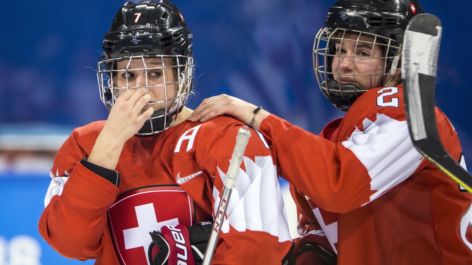 epa06535101 Lara Stalder of Switzerland, and Alina Muller of Switzerland, from left, react after the women&#039;s Ice Hockey quarterfinal match between Olympic Athletes from Russia and Switzerland at  ...