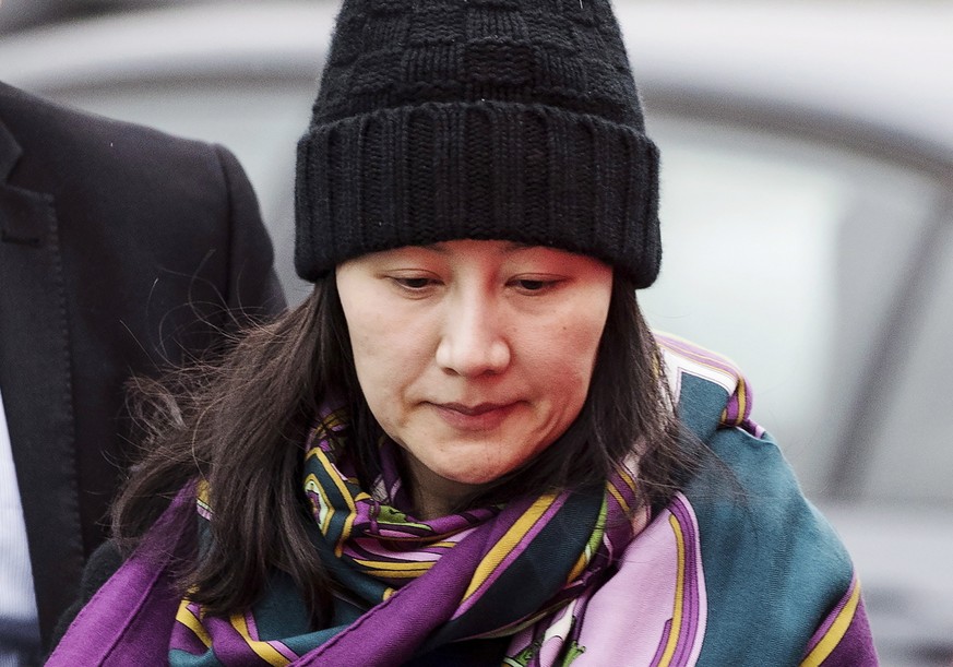 FILE - In this Dec. 12, 2018, file photo, Huawei chief financial officer Meng Wanzhou arrives at a parole office with a security guard in Vancouver, British Columbia. Canada arrested Meng at America’s ...