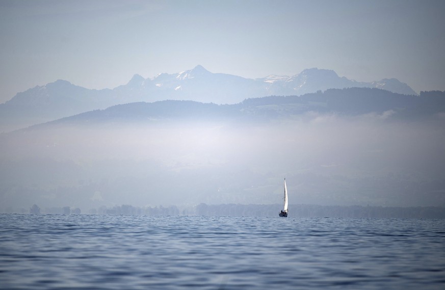 A boat sails in front of the Alps over the Lake Constance (Bodensee), southern Germany, Friday, Sept. 13, 2019. (Marijan Murat/dpa via AP)