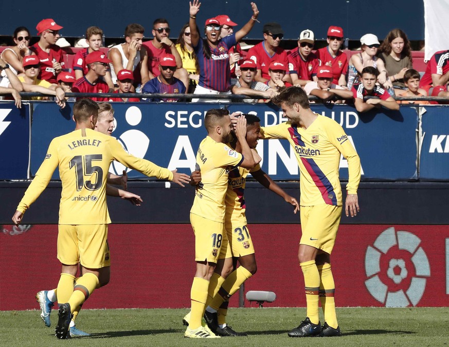 epa07807990 FC Barcelona&#039;s Ansu Fati (2-R) celebrates with teammates after scoring during the Spanish LaLiga soccer match between CA Osasuna and FC Barcelona at the El Sadar staidum in Pamplona,  ...