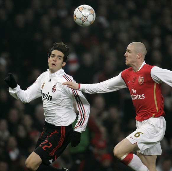 AC Milan&#039;s Kaka, left, vies for the ball with Arsenal&#039;s Philippe Senderos, right, during their Champions League round of 16 soccer match at the Emirates Stadium in London, Wednesday, Feb. 20 ...