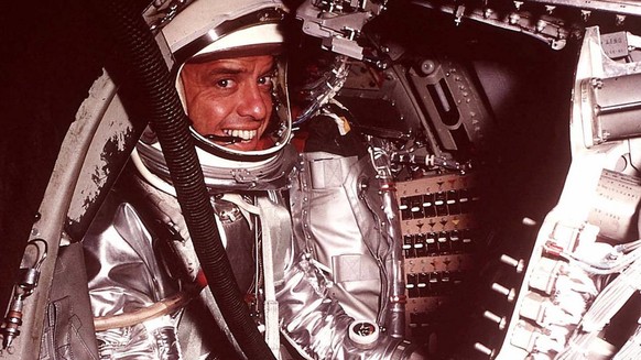 FILE--Astronaut Alan Shepard, Jr., poses in the Mercury space craft at Cape Canaveral in 1961. Shepard, the first American to fly in space and one of only 12 Americans to walk on the moon, died late T ...