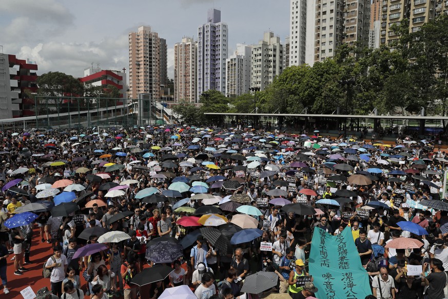 Protestors march to the Tuen Mun Park to protest against mainland Chinese singers causing nuisance to the local neighborhood, in Hong Kong, Saturday, July 6, 2019. The extradition protest sparked Hong ...