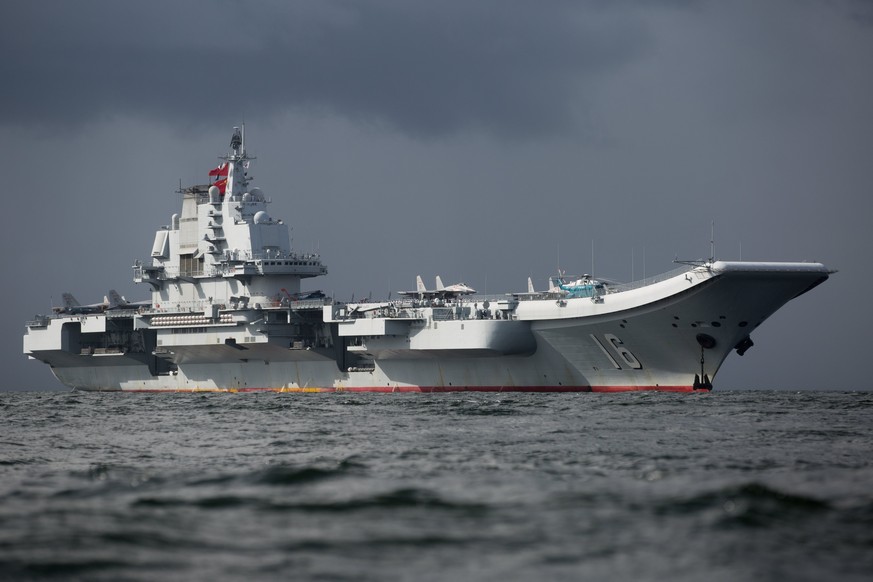 epa06071720 The Liaoning, the first aircraft carrier commissioned into China&#039;s military, arrives in Hong Kong, China, 07 July 2017. The Liaoning, a refitted former Soviet carrier that Beijing bou ...