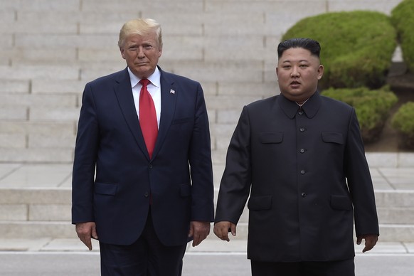 FILE - In this June 30, 2019, file photo, President Donald Trump, left, meets with North Korean leader Kim Jong Un at the North Korean side of the border at the village of Panmunjom in Demilitarized Z ...