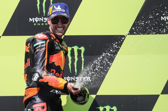epa08593287 South African rider Brad Binder of Red Bull KTM Factory Racing team celebrates on the podium after winning the MotoGP race of the Motorcycling Grand Prix of the Czech Republic at Masaryk c ...