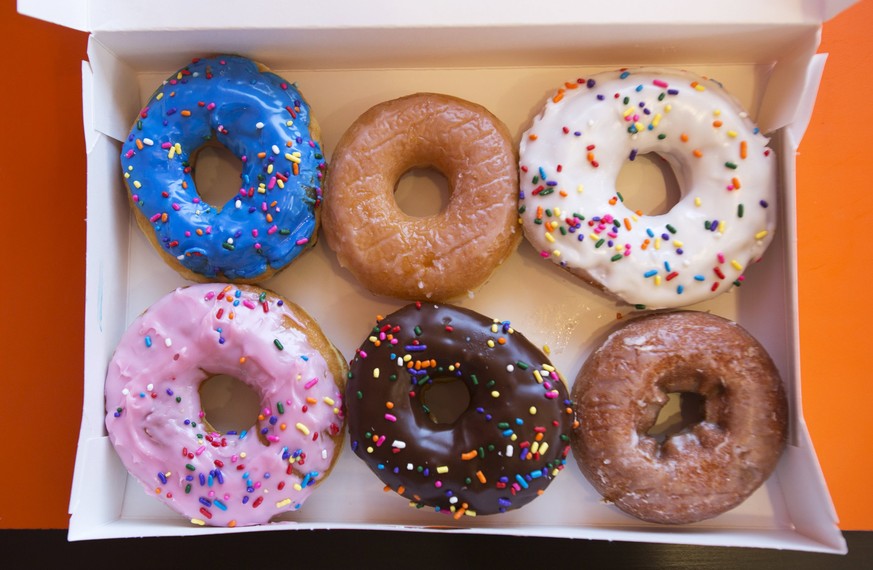 A box of donuts, (from top L clockwise) manager&#039;s special, traditional glazed, vanilla, pumpkin, chocolate and strawberry, is pictured at a newly opened Dunkin&#039; Donuts store in Santa Monica, ...