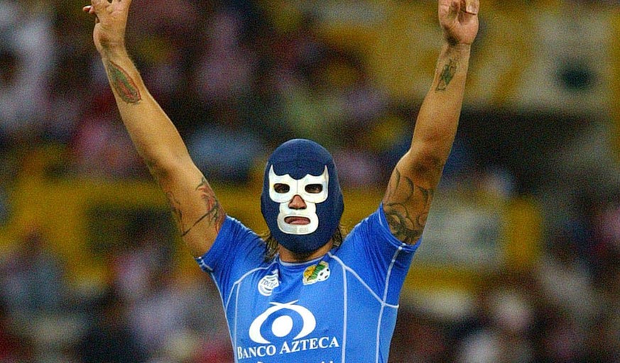 Jaguares of Chiapas goalie Omar Ortiz celebrates wearing a Mexican wrestling mask after his team scored a goal against Chivas of Guadalajara Thursday, May 4. 2006, at the Jalisco Stadium in Guadalajar ...