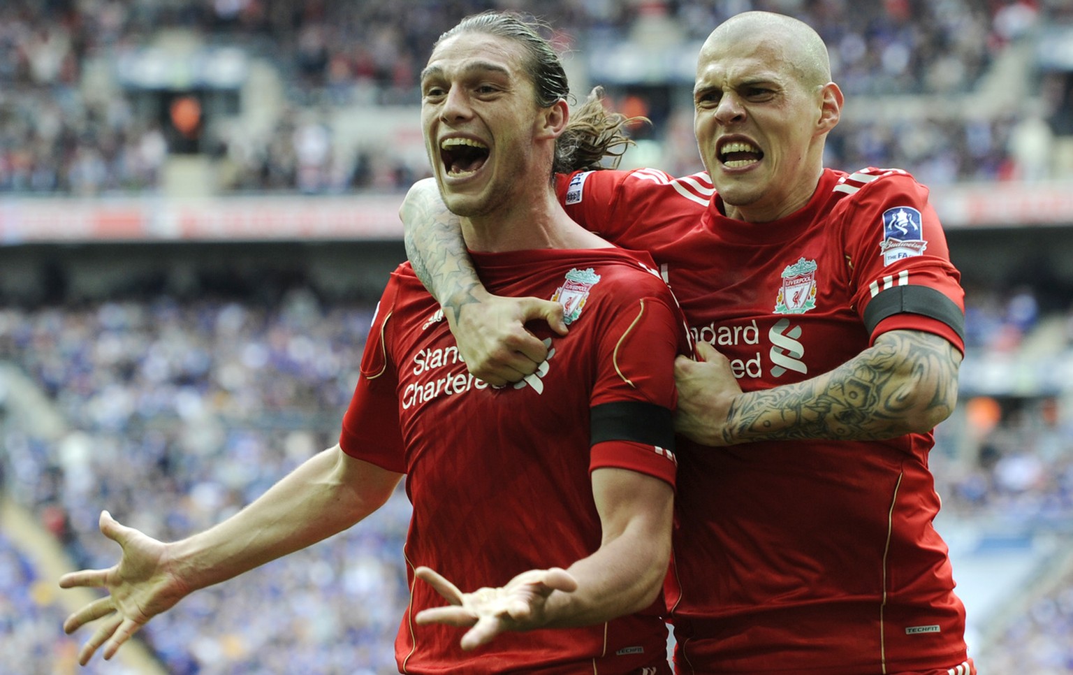 Liverpool&#039;s Andy Carroll, left, celebrates his goal against Everton with teammate Martin Skrtel during their English FA Cup semifinal soccer match at Wembley Stadium in London, Saturday, April 14 ...