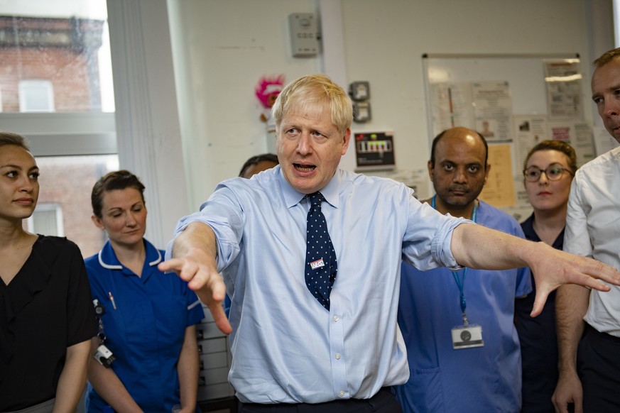 Britain&#039;s Prime Minister Boris Johnson looks on during a visit to North Manchester General Hospital before the Conservative Conference, in Manchester, England, Sunday, Sept. 29, 2019. British Pri ...