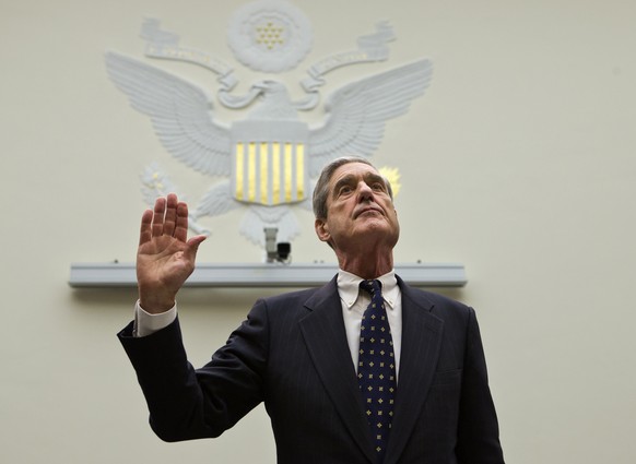 FILE - In this June 13, 2013 file photo, FBI Director Robert Mueller is sworn in on Capitol Hill in Washington prior to testifying before the House Judiciary Committee as it holds an oversight hearing ...