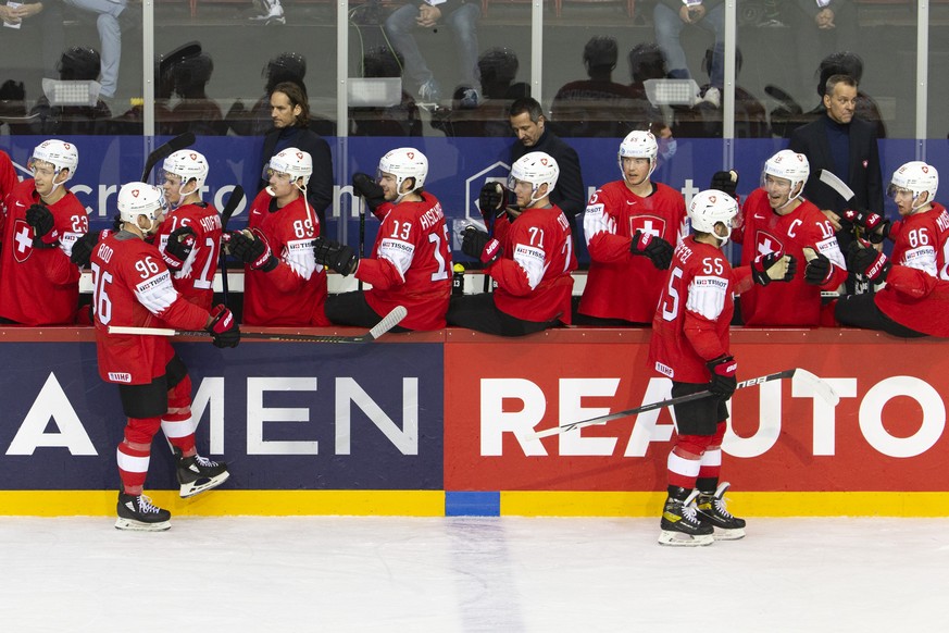 Switzerland&#039;s forward Noah Rod #86 and Switzerland&#039;s defender Romain Loeffel #55 celebrate with their teammates after scoring the 2:1, during the IIHF 2021 World Championship preliminary rou ...