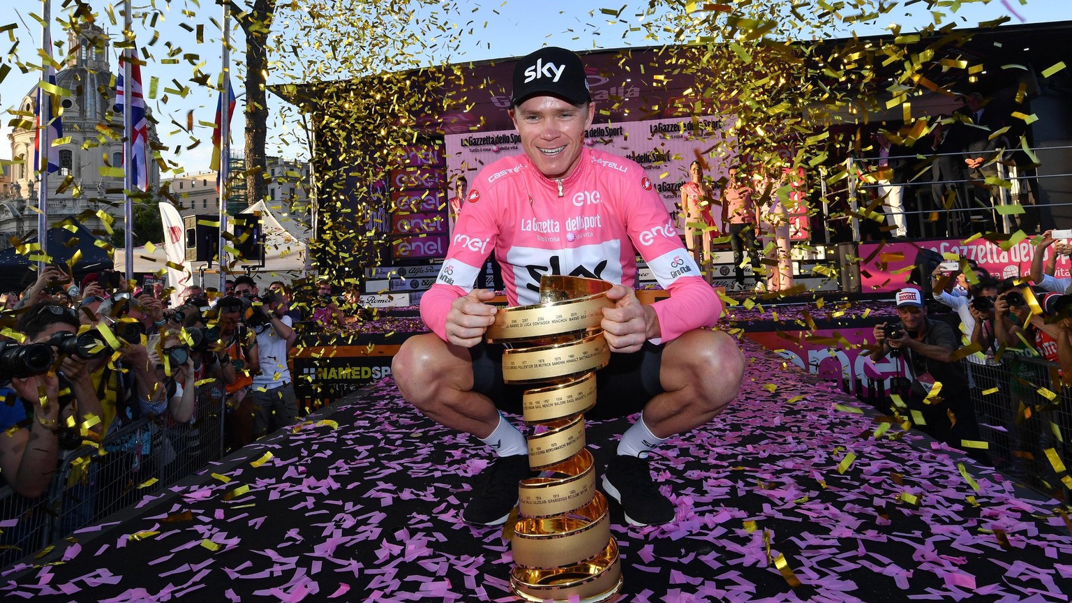 epa06767466 British Britain&#039;s Chris Froome poses with the trophy of the Giro d&#039;Italia cycling race after the twenty-first and final stage of the Giro d&#039;Italia cycling race, over 115 km  ...