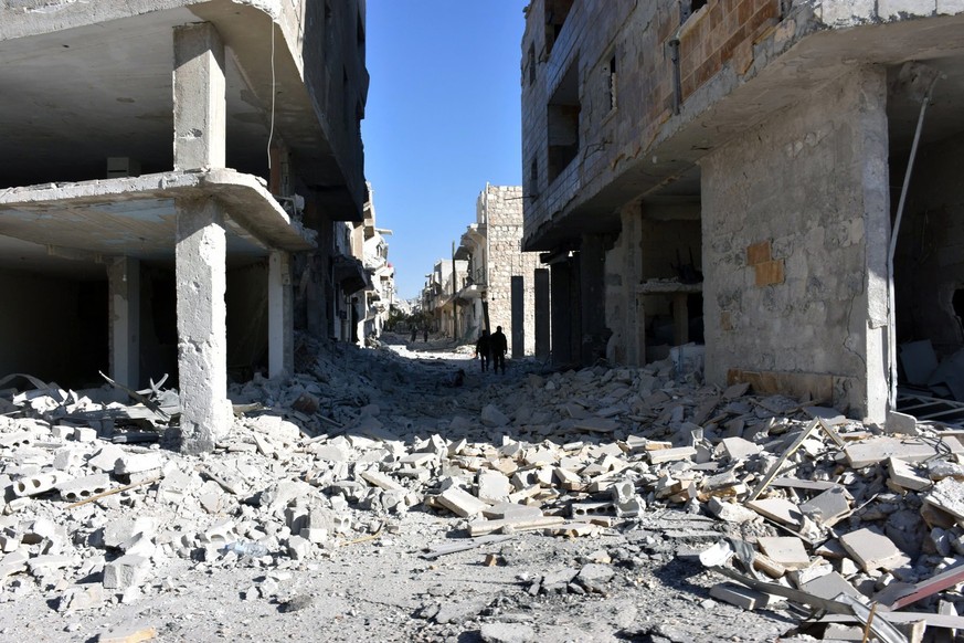 epa05650133 A handout picture made available by the official Syrian Arab News Agency (SANA) shows damaged buildings in Aleppo&#039;s eastern Masaken Hanano area in Aleppo province, Syria, 27 November  ...