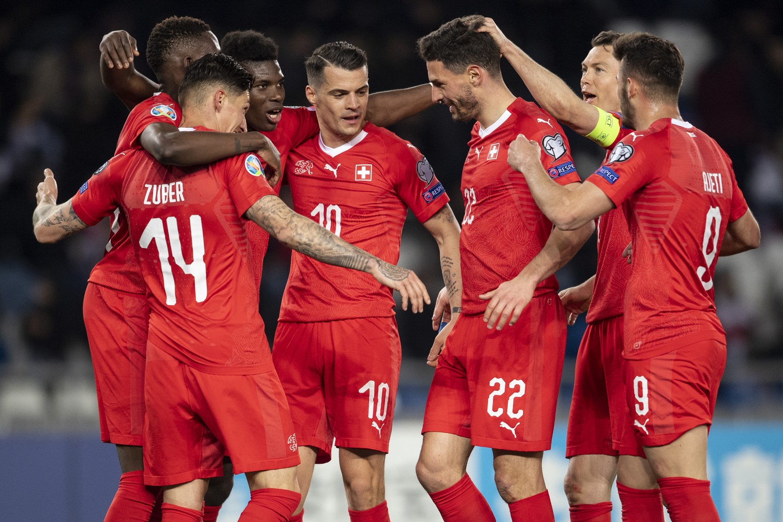 The team of Switzerland celebrate the second goal during the UEFA Euro 2020 qualifying Group D soccer match between Georgia and Switzerland at the Dinamo Arena in Tbilisi, Georgia, Saturday, March 23, ...