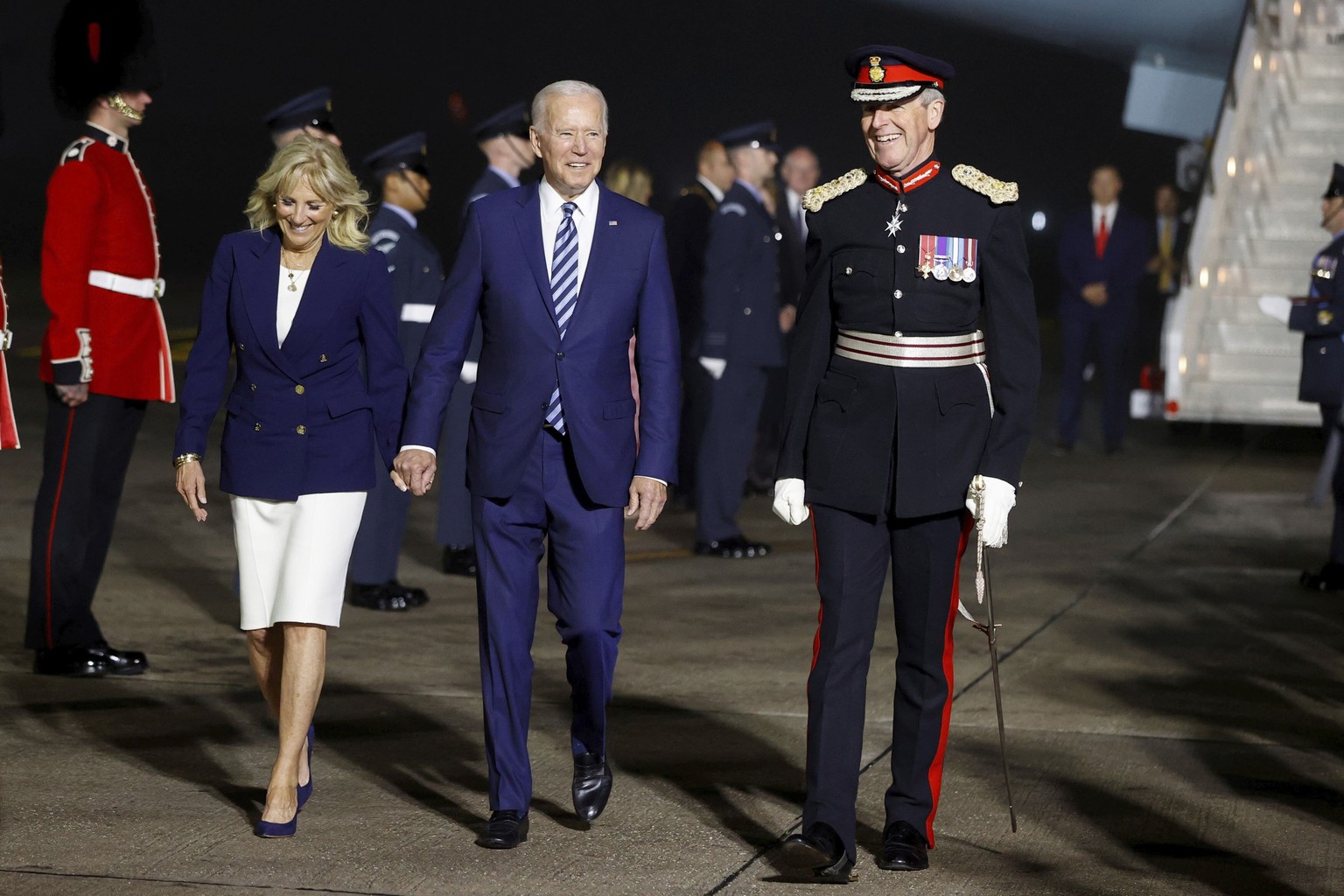 U.S. President Joe Biden and first lady Jill Biden arrive on Air Force One at Cornwall Airport Newquay, near Newquay, England, ahead of the G7 summit in Cornwall, early Thursday, June 10, 2021. (Phil  ...