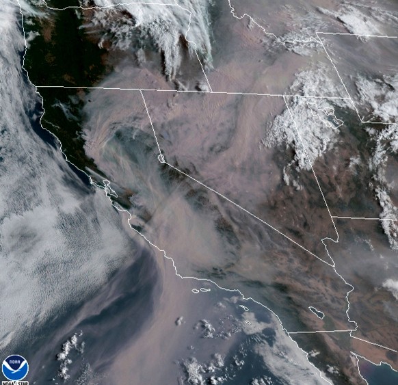 This satellite image from the Cooperative Institute for Research in the Atmosphere (CIRA) and released by the National Oceanic and Atmospheric Administration (NOAA) shows smoke from massive wildfires  ...