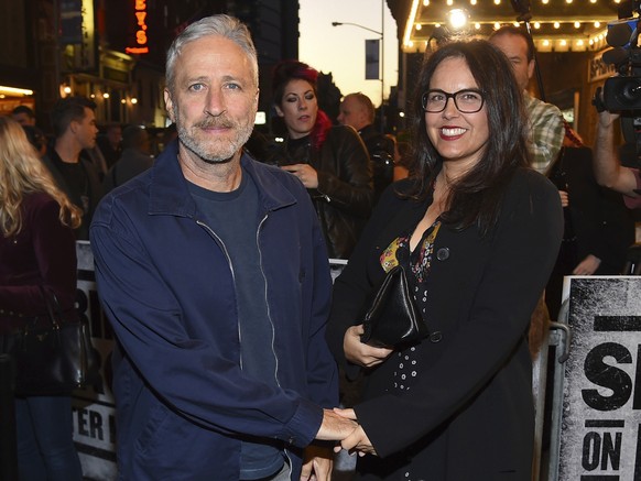 FILE - In this Oct. 12, 2017, file photo, Comedian Jon Stewart and wife Tracey arrive at &quot;Springsteen On Broadway&quot; opening night at the Walter Kerr Theatre in New York. Stewart has made a ho ...