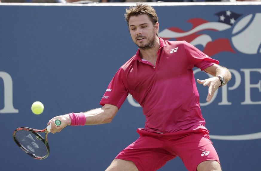 epa05525866 Stan Wawrinka of Switzerland hits a return to Illya Marchenko of Ukraine on the eighth day of the US Open Tennis Championships at the USTA National Tennis Center in Flushing Meadows, New Y ...
