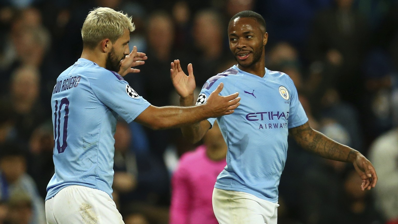 Manchester City&#039;s Raheem Sterling, left, celebrates with his teammate Sergio Aguero after scoring his side&#039;s fifth goal, during the group C Champions League soccer match between Manchester C ...