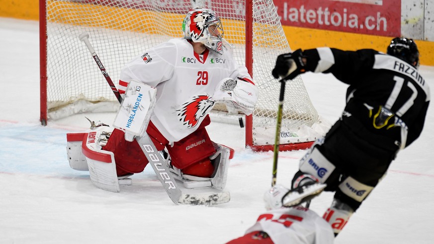 Lugano&#039;s player Luca Fazzini right, make the 4 - 3 goal in the over time, during the preliminary round game of National League A (NLA) Swiss Championship 2020/21 between HC Lugano against LHC Lau ...