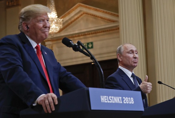 FILE - In this July 16, 2018, file photo Russian President Vladimir Putin, right, and U.S. President Donald Trump give a joint news conference at the Presidential Palace in Helsinki, Finland. For the  ...