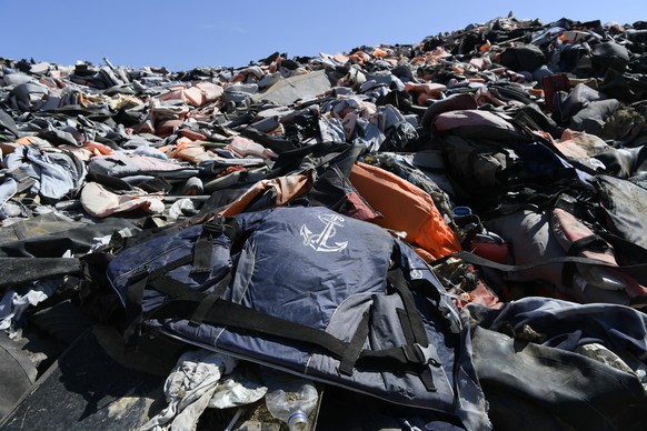 Piles of life jackets used by refugees and migrants lie at a dump in Molyvos village, on the northeastern Aegean island of Lesbos, Greece, Monday, Sept. 23, 2019. Security and municipal services on th ...