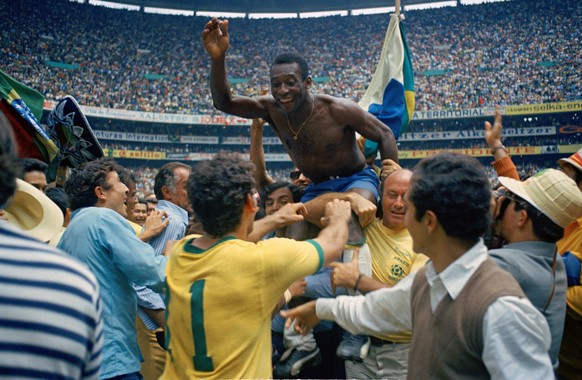 FILE - In this June 21, 1970 file photo, Brazil&#039;s Pele, centre is hoisted on the shoulders of his teammates after Brazil won the World Cup soccer final against Italy, 4-1, in Mexico City&#039;s E ...