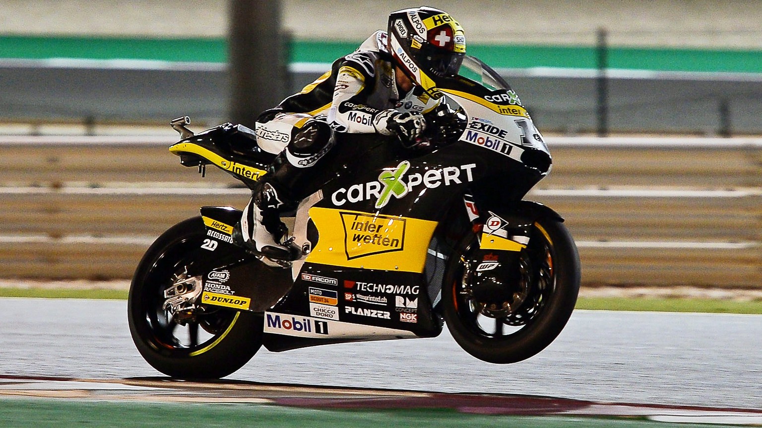 epa05868380 Swiss Moto2 rider Thomas Luthi of the CarXpert Interwetten team in action during a free practice session for the Motorcycling Grand Prix of Qatar at Al Losail International Circuit in Doha ...